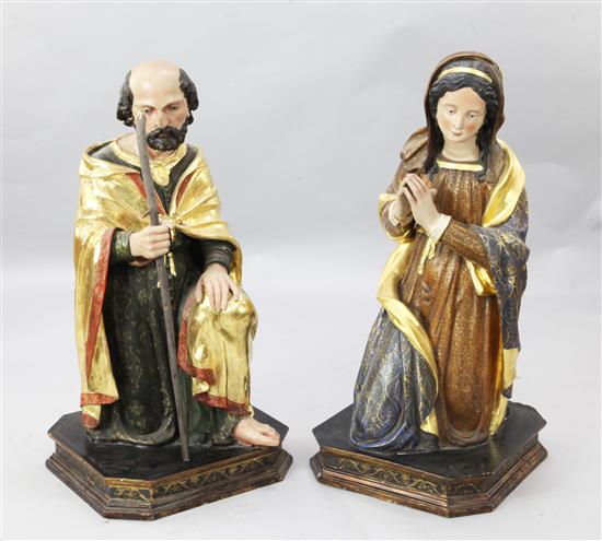 A pair of polychrome painted parcel gilt wooden altar figures of Joseph and Mary, 3ft